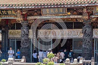 Believers piously worship in the Bangka Longshan Temple Editorial Stock Photo