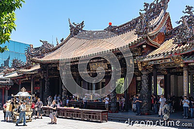 Believers piously worship in the Bangka Longshan Temple Editorial Stock Photo