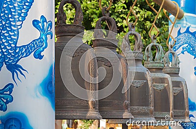 Bell with dragon pillar in belfry at thai temple Stock Photo