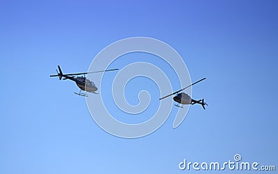Bell-206 helicopters aerobatic paired Editorial Stock Photo
