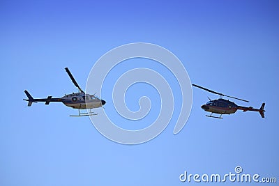 Bell-206 helicopters facing each other Editorial Stock Photo