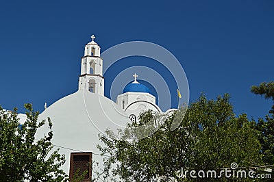 Bell Tower And Main Facade Of The Beautiful Church Of Pyrgos Kallistis On The Island Of Santorini. Travel, Cruises, Architecture, Stock Photo
