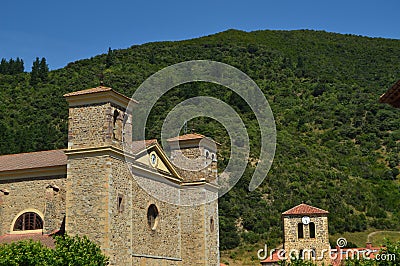 Bell Tower Of The New And Old Church Of San Vicente In Villa De Potes. Nature, Architecture, History, Travel. Editorial Stock Photo