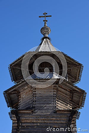 Bell tower with octagonal tent of ancient wooden Church of Annunciation of Blessed Virgin Mary in Annunciation village, courtyard Stock Photo