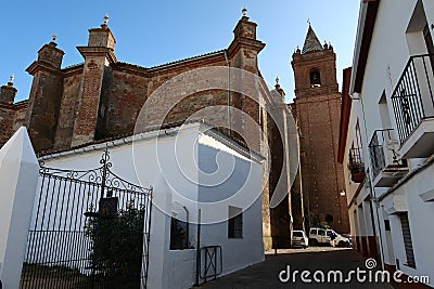 Bell tower and rear facade of the Divino Salvador church in the magical Andalusian town of Cortegana, Huelva, Spain Editorial Stock Photo
