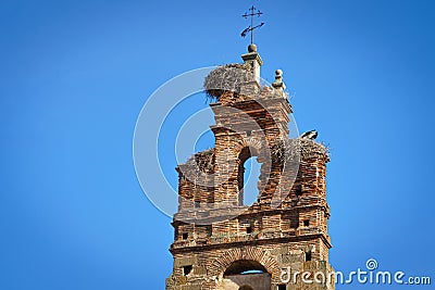 Bell tower with a storks nest in Plasencia old town. Stock Photo