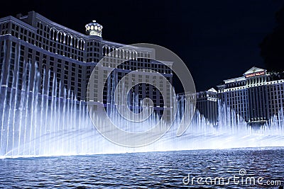 Bellagio Hotel Fountain show in cool blue setting Editorial Stock Photo