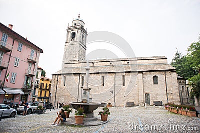 Bellagio. Lake Como. Basilica di San Giacomo in Bellagio. Square with Fountain in Old Town Editorial Stock Photo
