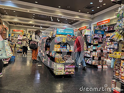 Bellevue, WA USA - circa December 2022: Wide view of people Christmas shopping for their children inside a toy store in the Editorial Stock Photo