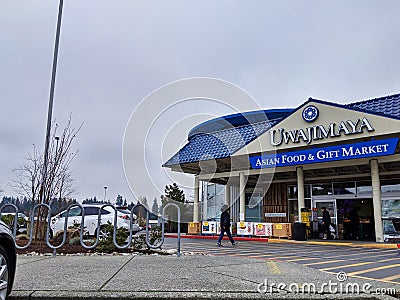 BellExterior view of Uwajimaya Asian Grocery store front as customers are entering and Editorial Stock Photo