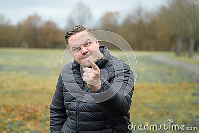 Belligerent aggressive young man threatening the viewer Stock Photo