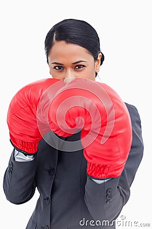 Belligerent saleswoman with boxing gloves Stock Photo