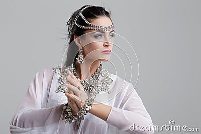 Belly dancer dancing on grey background Stock Photo