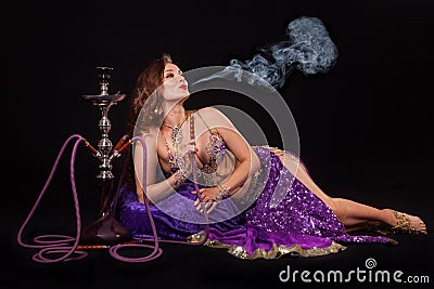 Belly dancer with hookah Stock Photo