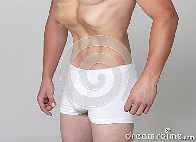 Belly exercise. Healthy man body, waistline. Slim male torso, waist, belly, abdomen. Sport, fitness, Dieting results Stock Photo