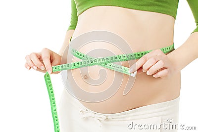 Belly of pregnant woman with measure Stock Photo