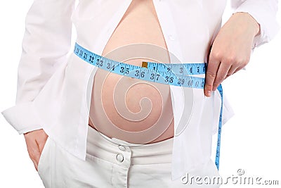 Belly of pregnant woman measuring belly Stock Photo