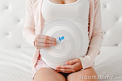 Belly of white Caucasian pregnant woman Stock Photo