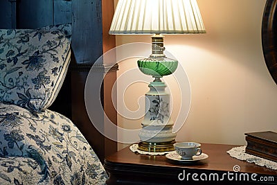 Belmont antebellum plantation bedside detail oil lamp and teacup Stock Photo