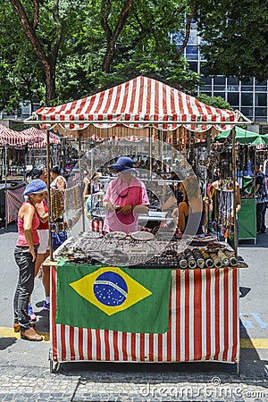 Indigenous Brazilian man selling arts and crafts at a street mar Editorial Stock Photo