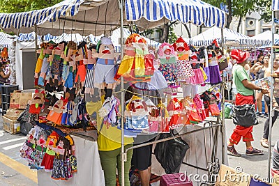 Ventriloquist toys for sale on display at a street market in Bel Editorial Stock Photo