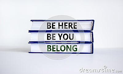 Belong symbol. Books with words `be here, be you, belong` on beautiful white table, white background. Business, belonging and Stock Photo