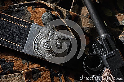 Belt Wehrmacht soldier and pistol Parabellum on camouflage uniforms Stock Photo