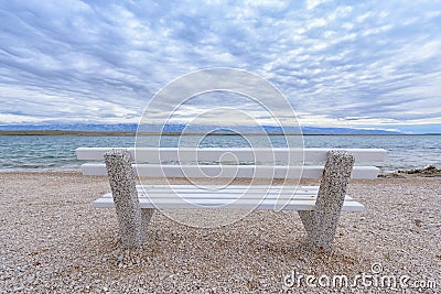 Bench on the beach Stock Photo