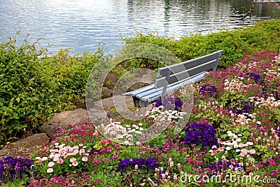 Bench and flowers at alpen lake in Montreux (Switzerland) Stock Photo