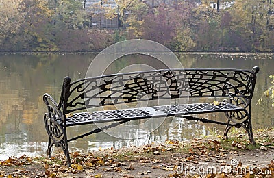 Bench on the lake shore, raw Stock Photo