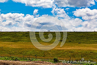 A bench on a levy Stock Photo