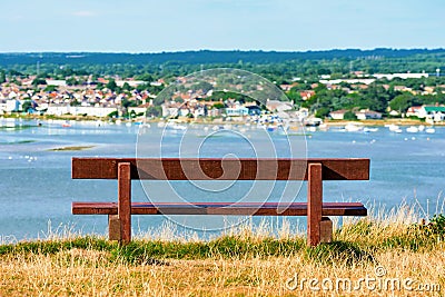 Bench with out of focus town Stock Photo