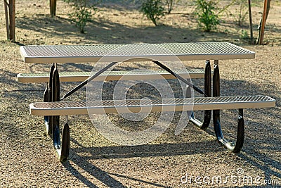 Bench in public area used to picnics and eating lunch or diner in an outdoor park or recreation area in nature Stock Photo