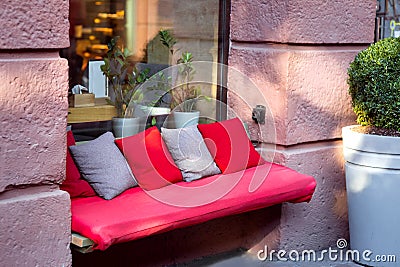 A bench with a red soft mattress. Stock Photo