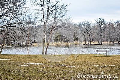 Bench by Rock River - Riverside Park - Janesville, WI Stock Photo