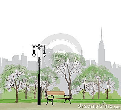 Bench and streetlight in park over city background. Stock Photo