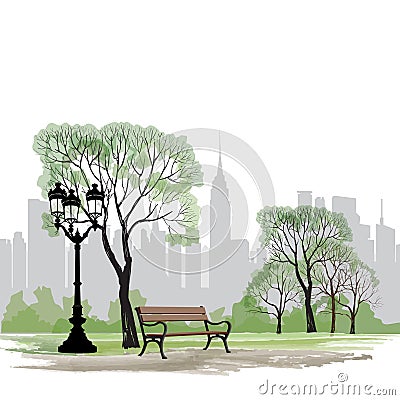 Bench and streetlight in park over city background. Landscape Stock Photo