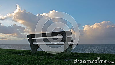 A bench with a view on clouds Stock Photo
