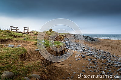 Bench view of storm coming in over Northam Burrows, North Devon, UK. Stock Photo