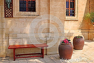Bench and wine bowls with flowers near the Cana greek orthodox wedding church in Cana of Galilee, Kfar Kana Stock Photo