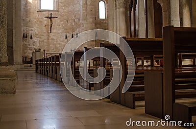 Benches of a catolic italian church Stock Photo