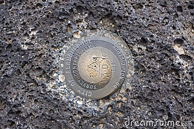 Benchmark found in volcanic rock Stock Photo