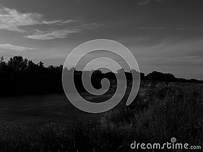 Bending river with banks on a black and white photo Stock Photo