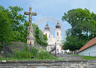 Benedictine Tihany Abbey in Hungary, with stone cross of Christ Editorial Stock Photo