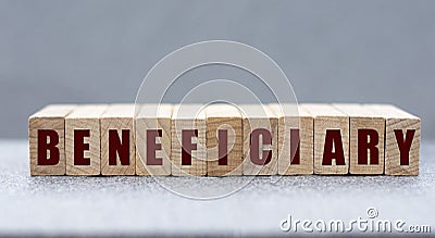 BENEFICIARY - word on wooden bars on a gray background Stock Photo