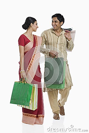 Bengali couple carrying shopping bags Stock Photo