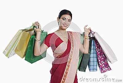 Bengali woman carrying shopping bags Stock Photo