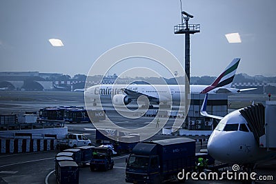 Bengaluru, India - December 13th 2022: Indian aircraft landed in a busy airport terminal engine wings close view international Editorial Stock Photo