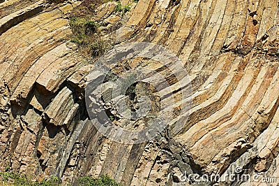 Bent hexagonal columns of volcanic origin at the Hong Kong Global Geopark in Hong Kong, China. Stock Photo