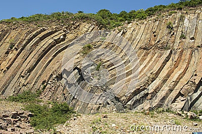 Bent hexagonal columns of volcanic origin at the Hong Kong Global Geopark in Hong Kong, China. Stock Photo